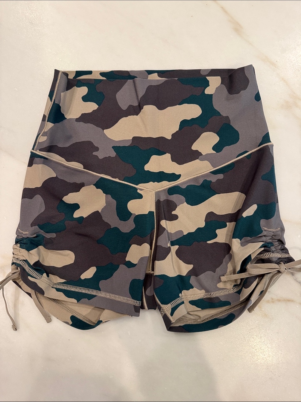 Aerie biker shorts in camo with side tie. Brand new without tags. Size medium.